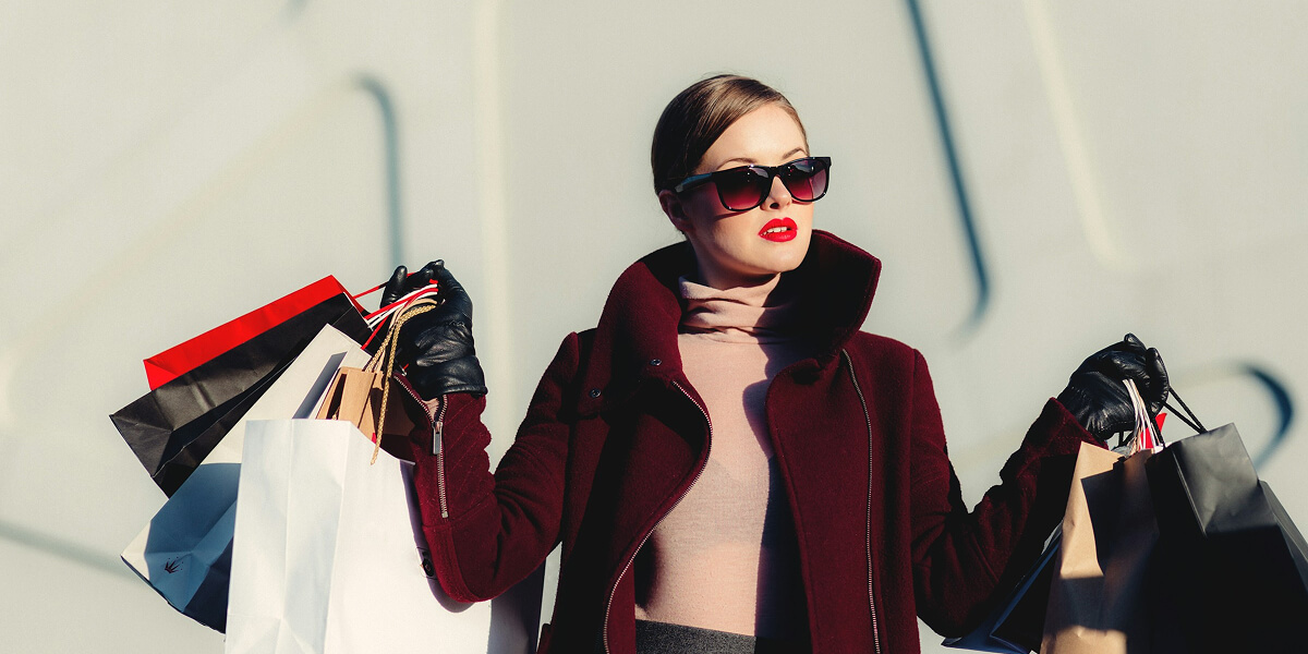 woman holding shopping bags